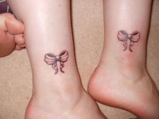 Ribbons Tattoo On Legs