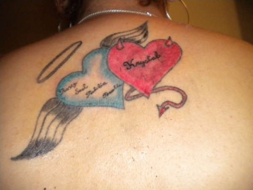 Two Hearts Tattoo On Back