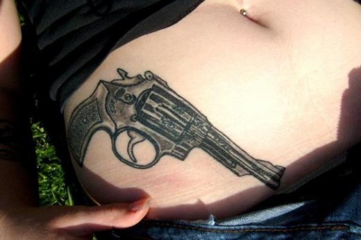 Cool Gun Tattoo On Waist
