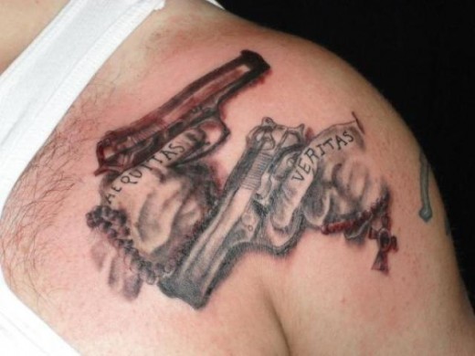 Pistols Tattoo On Shoulder