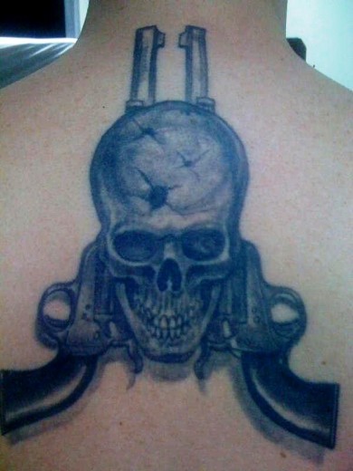 Skull & Guns Tattoo On Back