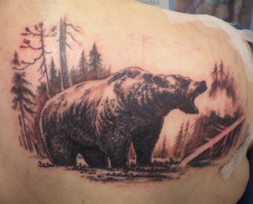 Bear Tattoo On Upper Back