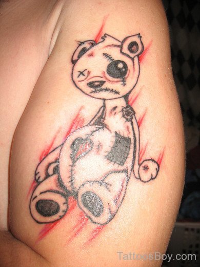Evil Teddy Bear Tattoo On Biceps