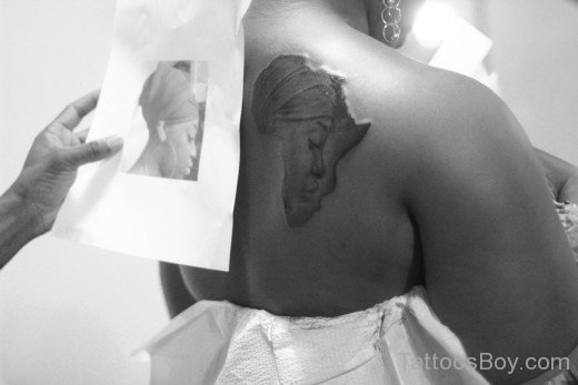 African Queen Face Tattoo On Back  Body