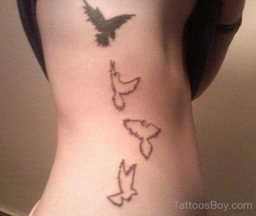 Flying Birds Atheist Tattoo On Body Side Rib