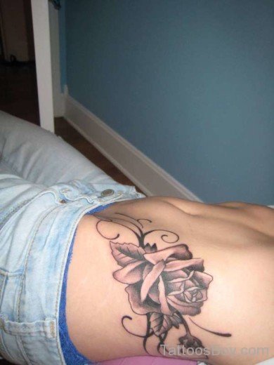 Cute Flower Tattoo On Rib 