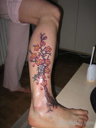 Lovely Cherry Blossom Flowers Tattoo On Legs 