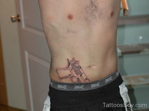 Pistol Tattoo On Belly