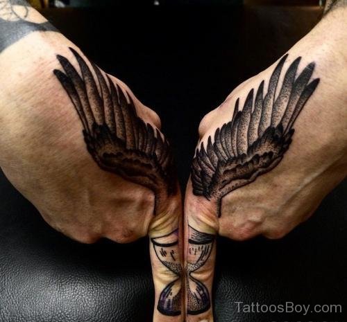 Attractive Wings Tattoo On Finger