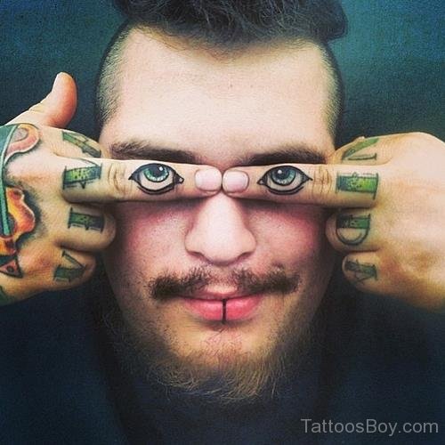 Fantastic Eyes Tattoo On Finger