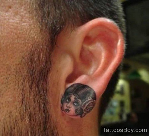 Girl Face Tattoo On Ear