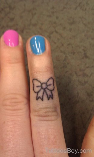 Nice Bow Tattoo On Finger