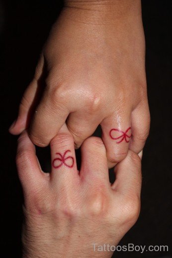 Red Bow Tattoo On Finger