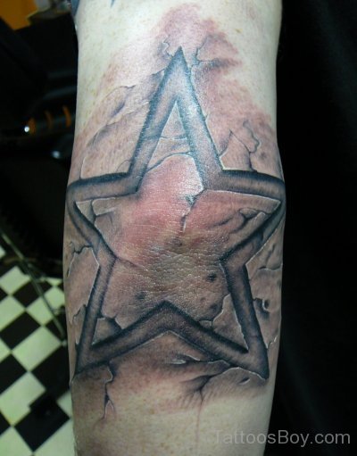 Funky Star Tattoo On Elbow 
