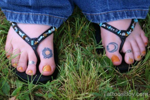 Sun And Star Tattoo On Toe