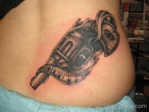 Gun Tattoo On Lower Back
