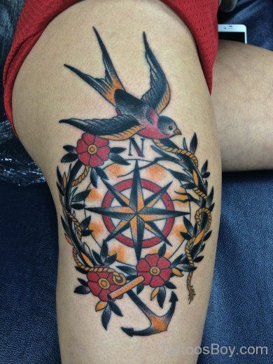 Compass And Bird Tattoo On Thigh