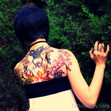 Skull And Flower Tattoo On Back