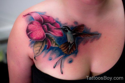 Hummingbird And Lily Flower Tattoo On Chest