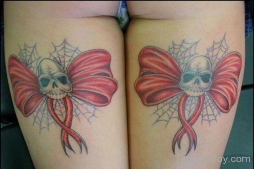 Skull And Bow Tattoo On Thigh