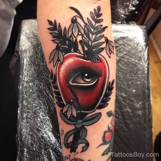 Apple And Eye Tattoo On Arm
