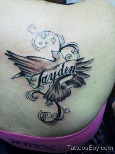 Dove And Filigree Tattoo On Back