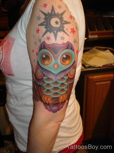 Owl And Star Tattoo On Bicep