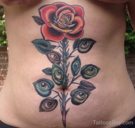 Rose And Eye Tattoo On Stomach