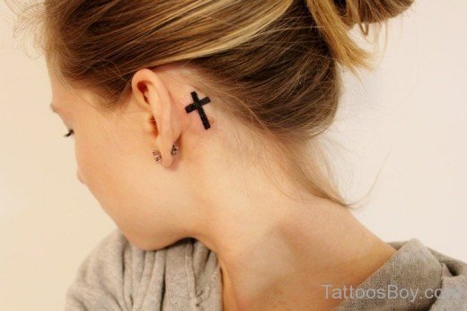 Black Cross Tattoo On Behind Ear