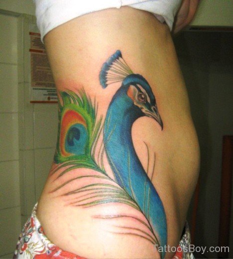 Peacock Tattoo On Rib 