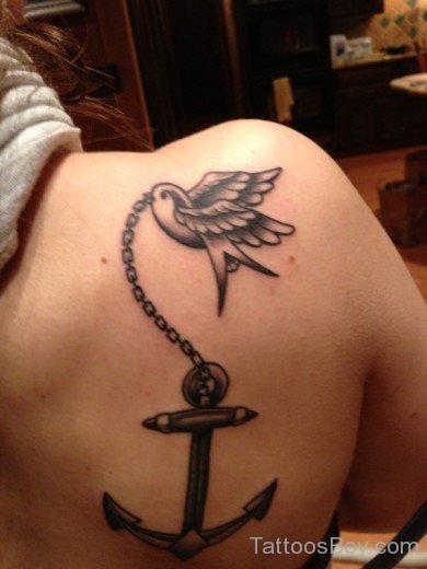 Bird And Anchor Tattoo On Back