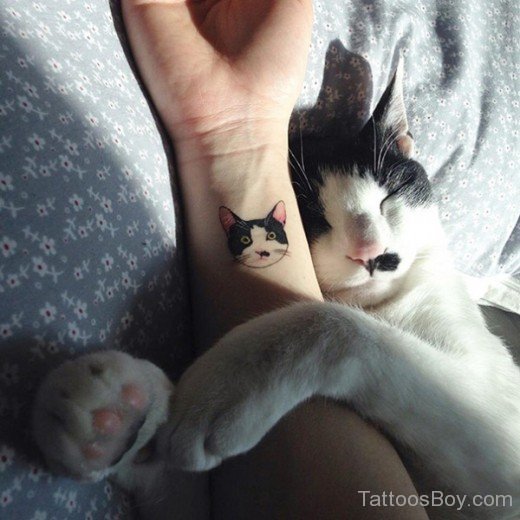 Cat Face Tattoo On Wrist