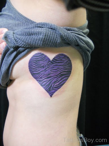 Colored Heart Tattoo On Rib