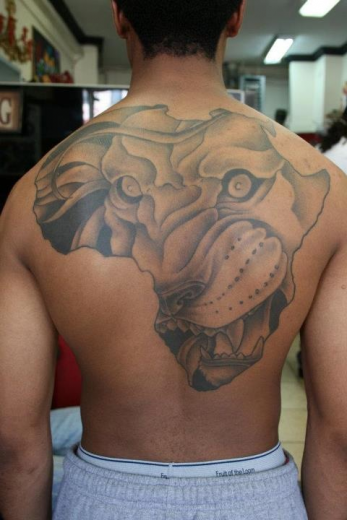 Map And Lion Tattoo On Back