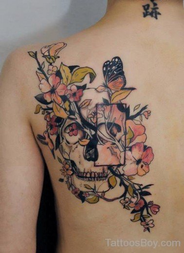 Skull And Flower Tattoo On Back