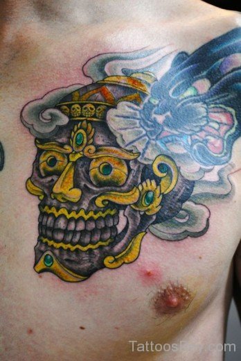 Yellow Skull Tattoo On Chest