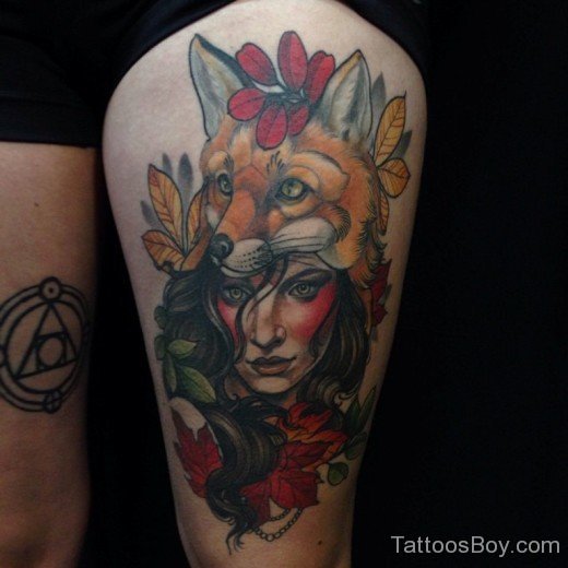  Fox And Girl Face Tattoo On Thigh