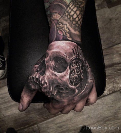 Skull And Clock Tattoo On Hand-TB12135
