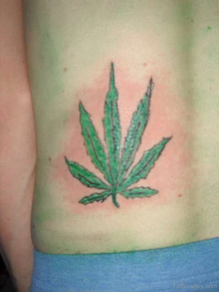 Green Leaf Tattoo On Lower Back.