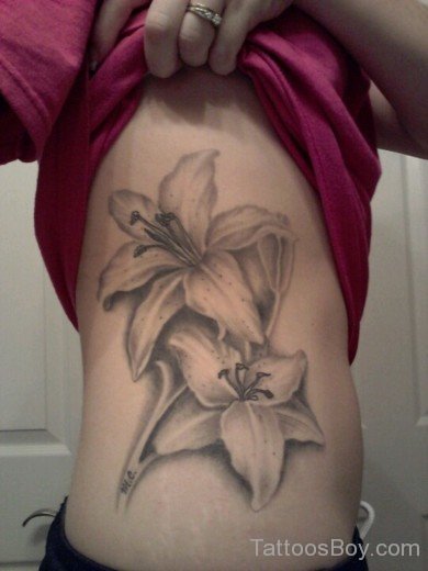  Lily Tattoo Design On Rib 