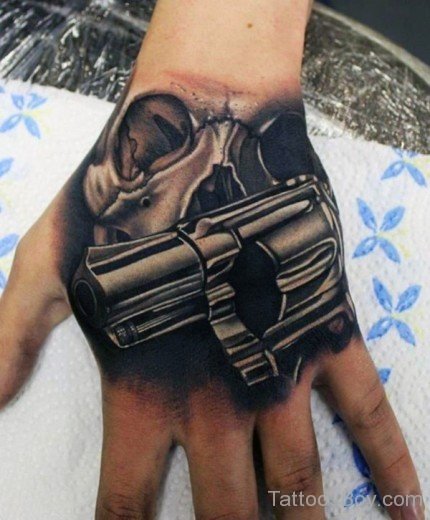 Gun And Skull Tattoo On Hand-TB1045