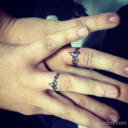 https://www.tattoosboy.com/wp-content/uploads/2016/04/Awesome-Ring-Tattoo-TB105.jpg