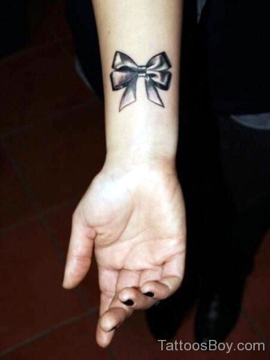 Black Bow Tattoo On Wrist