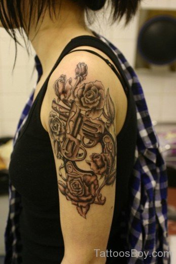 Flower And Gun Tattoo