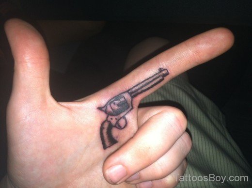 Gun Tattoo On Finger