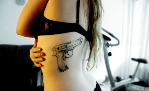Gun Tattoo On Rib