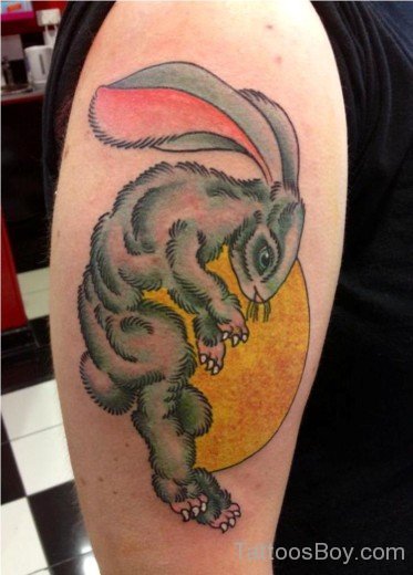 Rabbit Looking Down Tattoo On Biceps-TB163