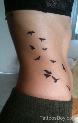 Flying Bird Tattoo On Rib