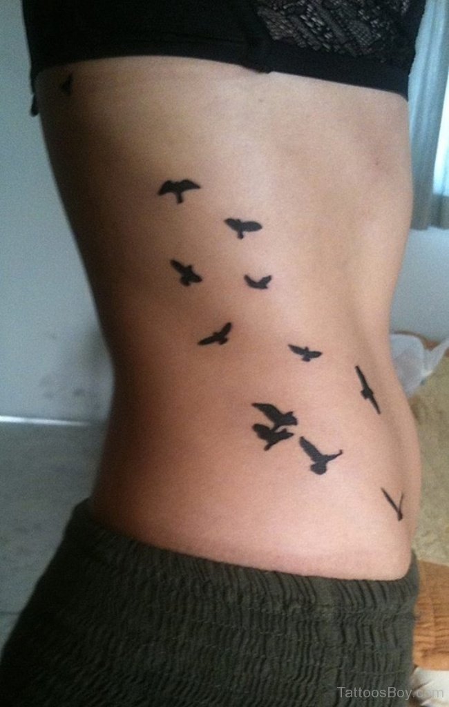 Flying Bird Tattoo On Rib | Tattoo Designs, Tattoo Pictures