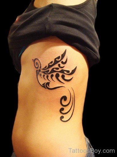 Tribal Bird Tattoo On Rib